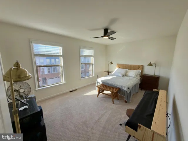 a bedroom with furniture and a window
