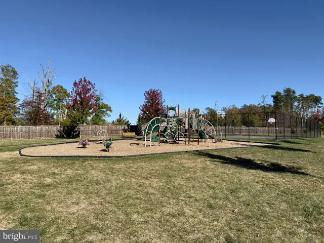 a view of a swimming pool with a yard