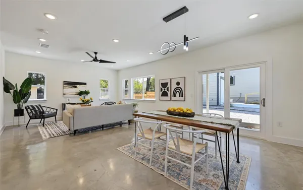a living room with furniture and a table