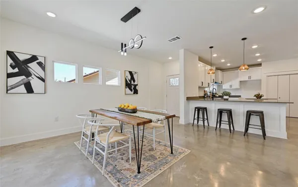 a view of kitchen with furniture and wooden floor