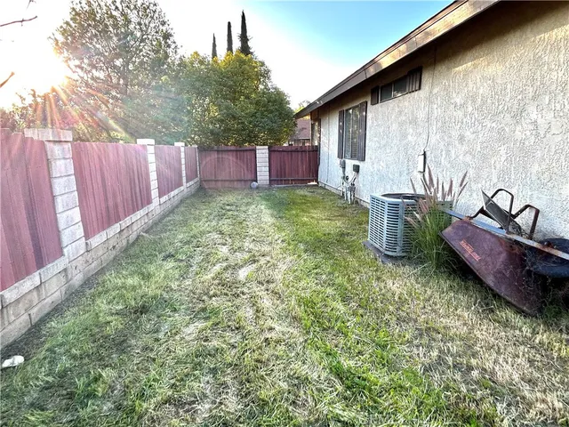 a view of a backyard with plants and trees