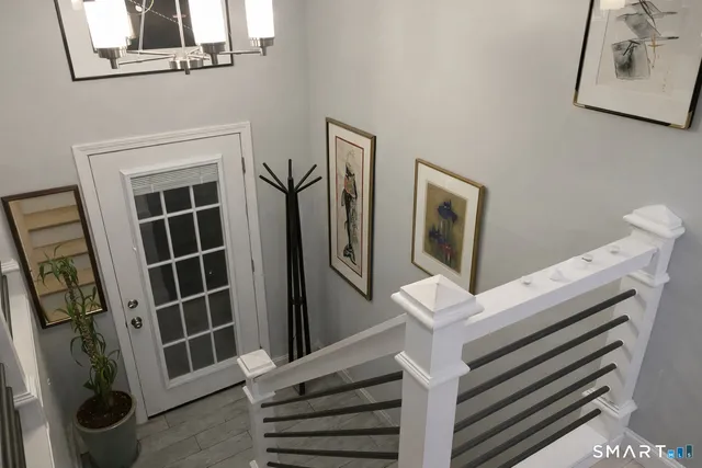 a view of an entryway with wooden floor