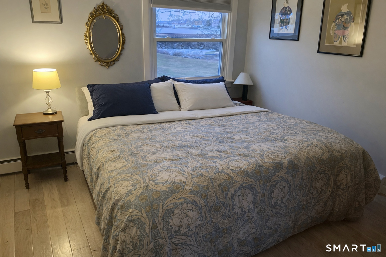 201 Seneca Drive Groton, CT 06340 - Photo 16 of 23 a bedroom with a bed and a lamp on table