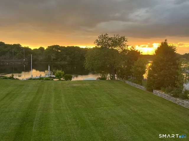 a view of lake with green space