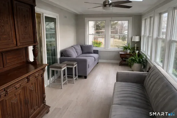 a living room with furniture and a large window