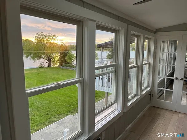 a bedroom with bed and window