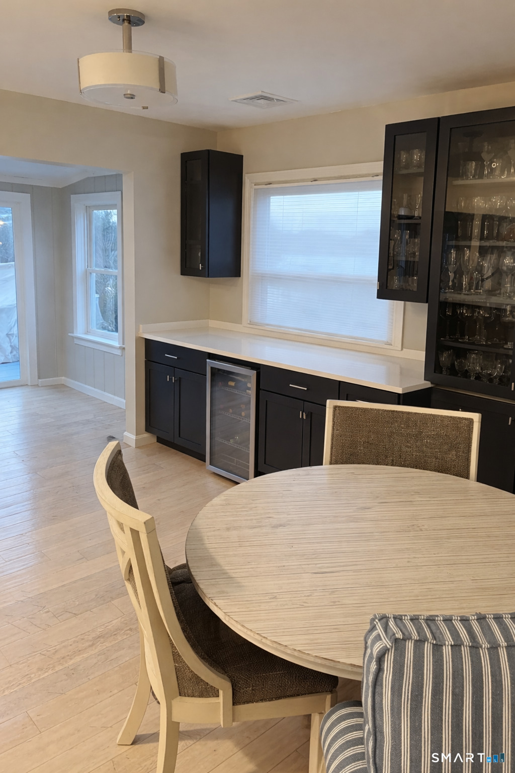 201 Seneca Drive Groton, CT 06340 - Photo 7 of 23 a kitchen with a table chairs sink and microwave