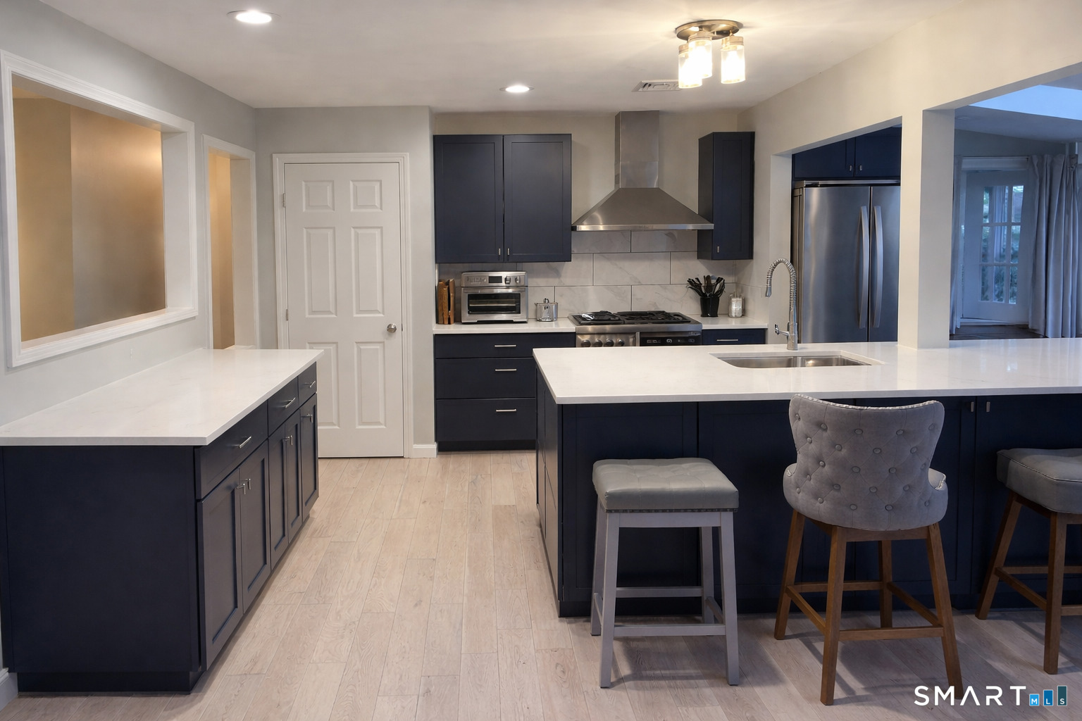 201 Seneca Drive Groton, CT 06340 - Photo 8 of 23 a kitchen with a sink cabinets and window