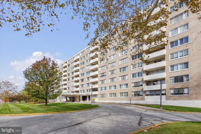 a kitchen with white cabinets and appliances