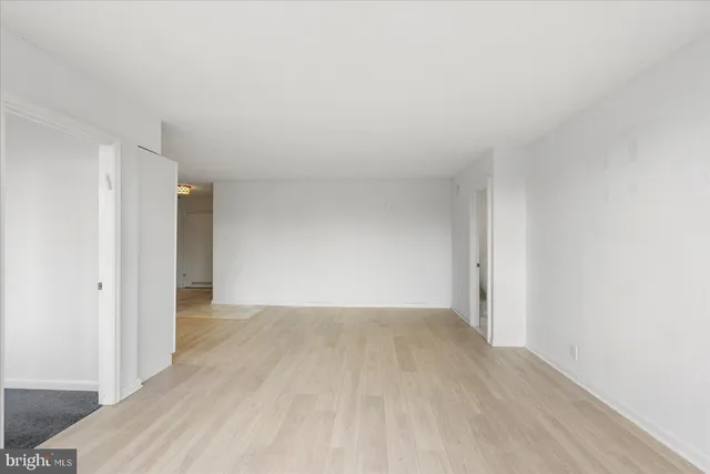 a kitchen with cabinets stainless steel appliances and a sink