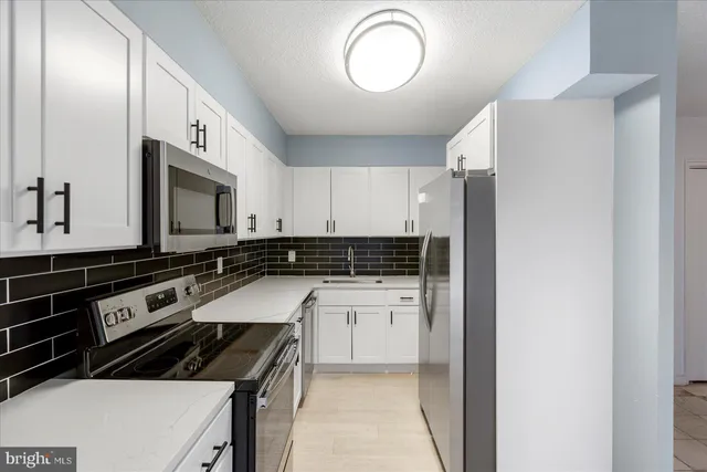 a view of a sink and dishwasher