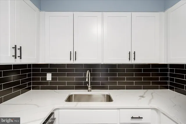 a kitchen with a stove and a microwave