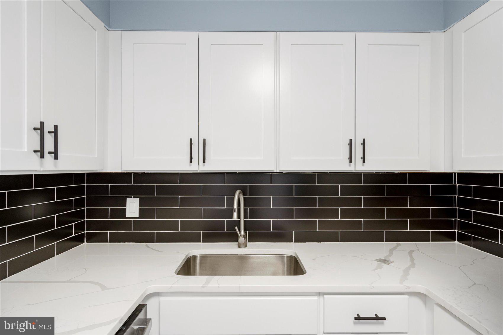 7111 Park Heights Avenue, Unit 305 Baltimore, MD 21215 - Photo 14 of 33 a view of a sink and dishwasher