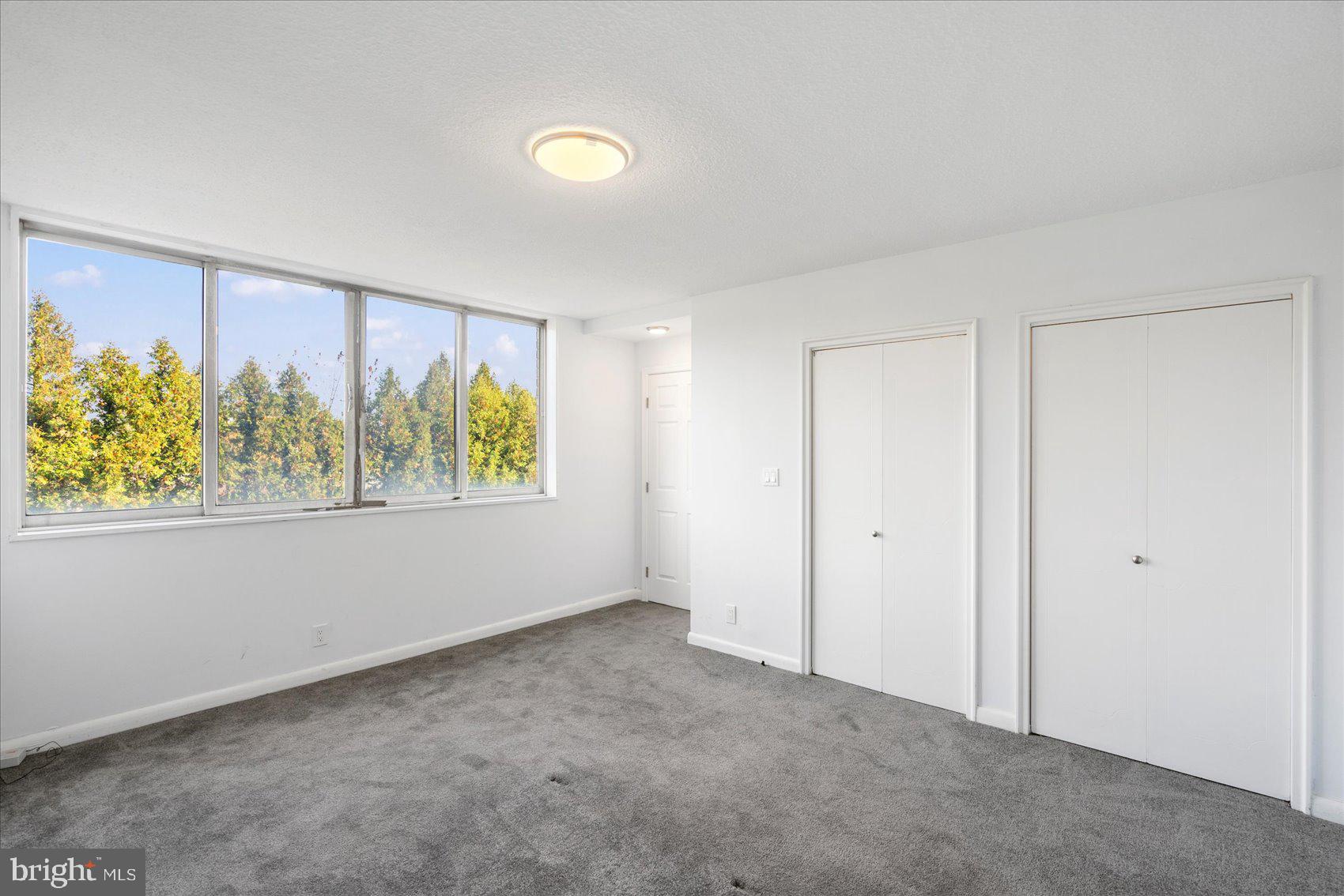 7111 Park Heights Avenue, Unit 305 Baltimore, MD 21215 - Photo 18 of 33 a view of an empty room with a window