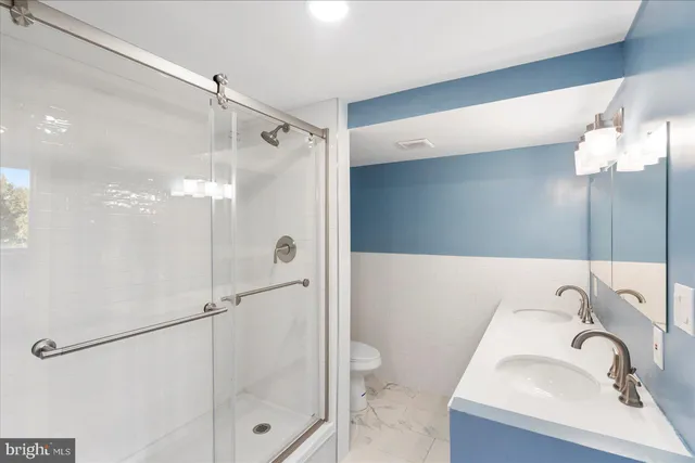 a white bath tub sitting in a bathroom