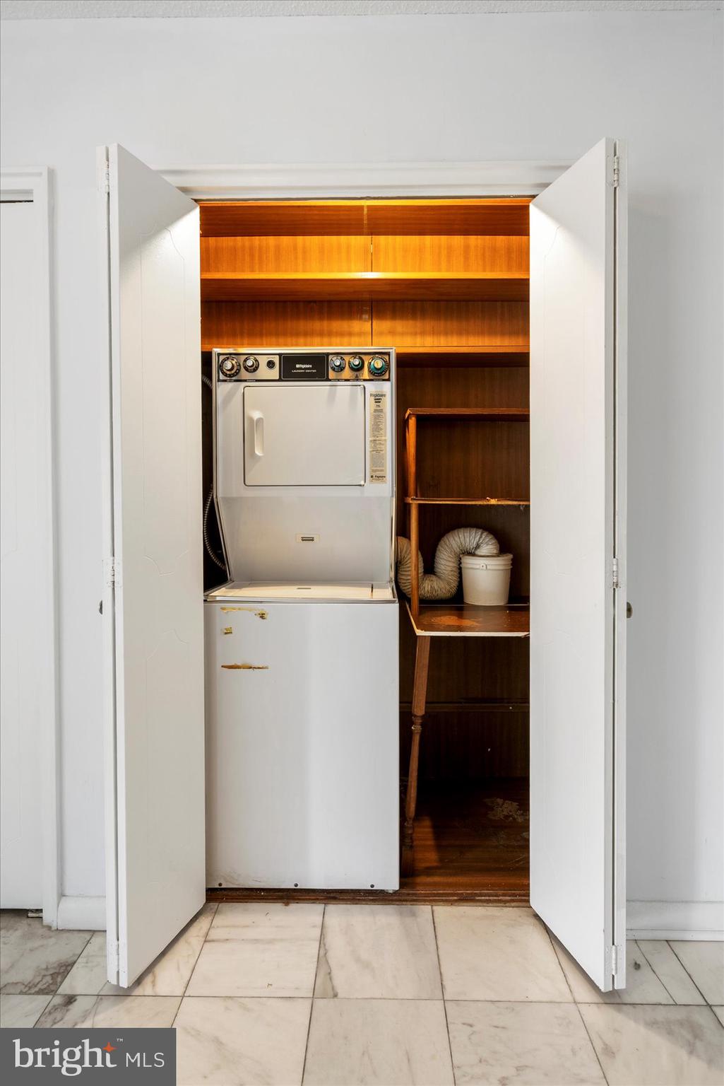 7111 Park Heights Avenue, Unit 305 Baltimore, MD 21215 - Photo 24 of 33 a utility room with washer and dryer