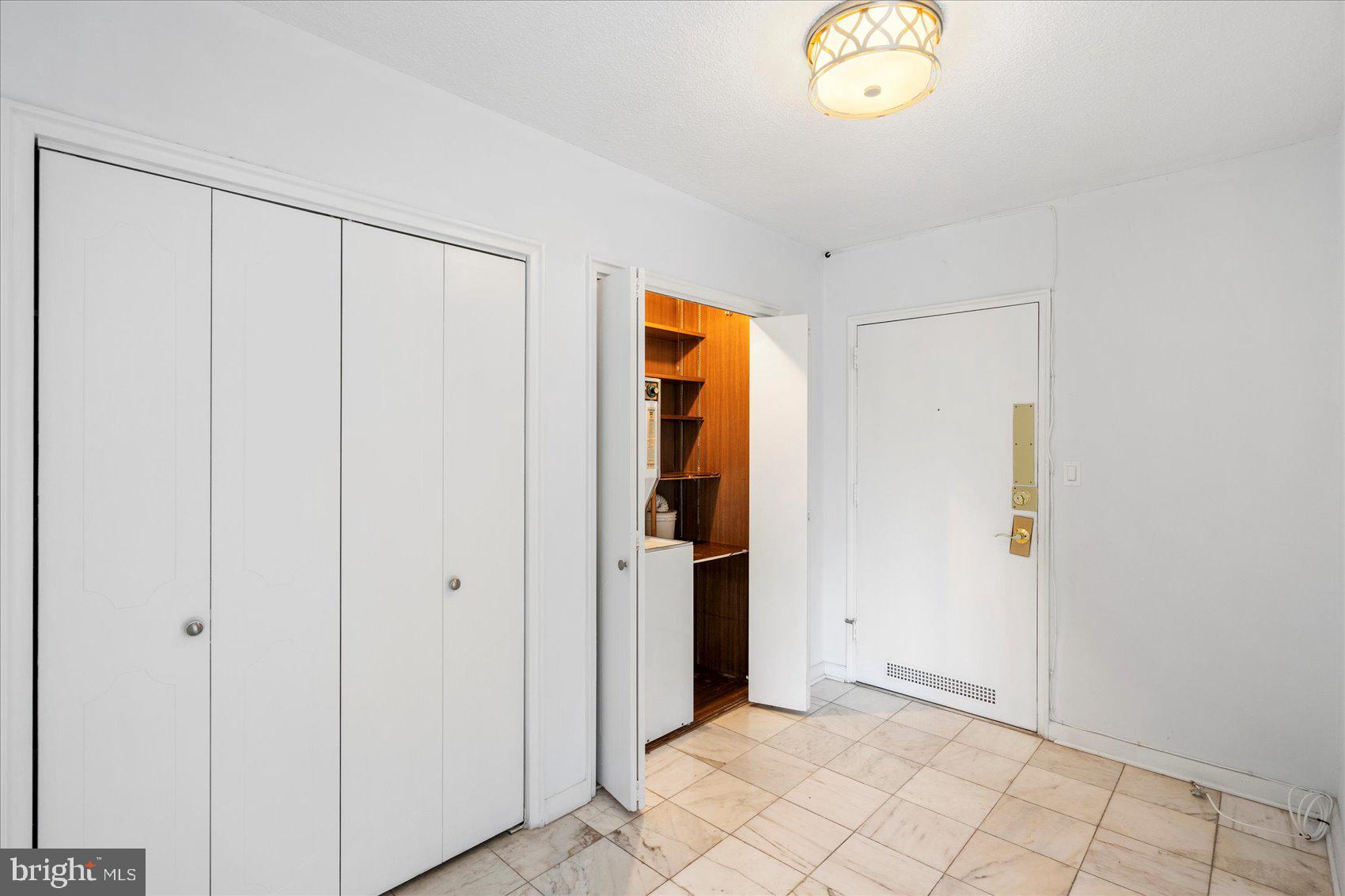 7111 Park Heights Avenue, Unit 305 Baltimore, MD 21215 - Photo 25 of 33 a view of entryway with wooden floor