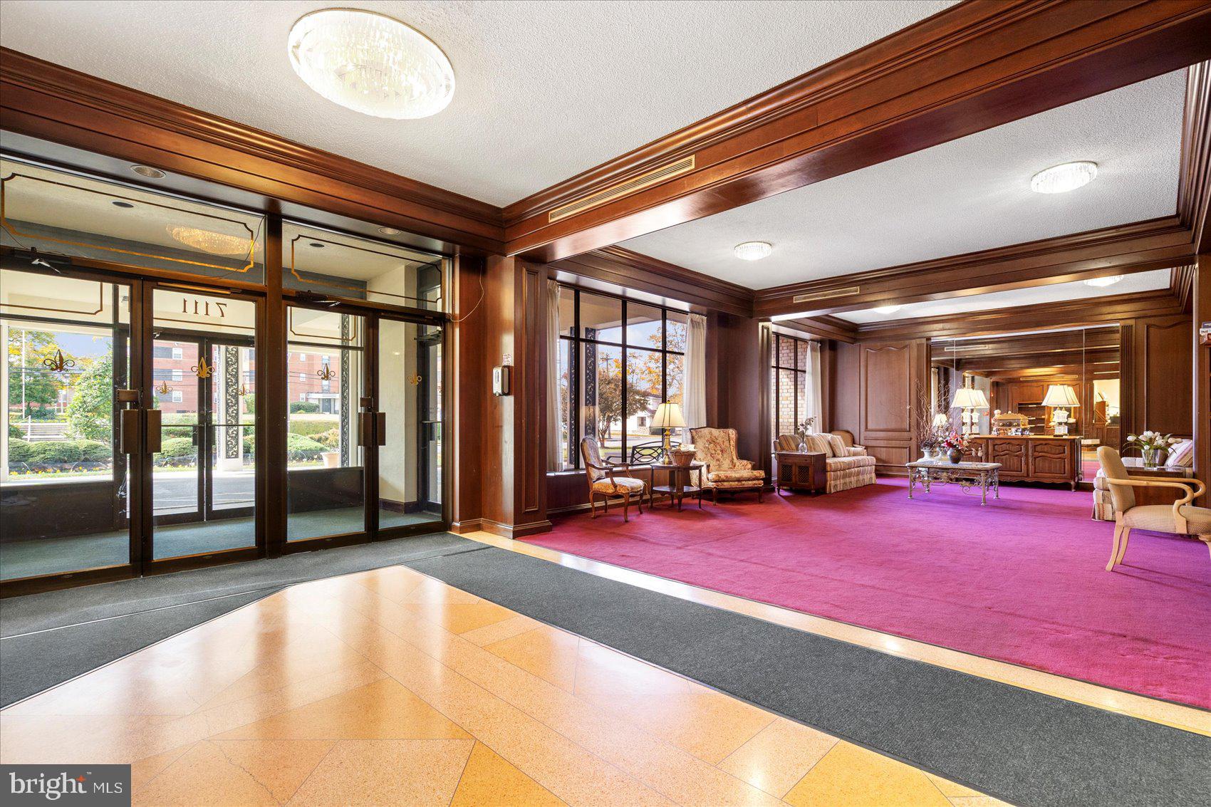 7111 Park Heights Avenue, Unit 305 Baltimore, MD 21215 - Photo 26 of 33 a view of a room with gym equipment and large windows