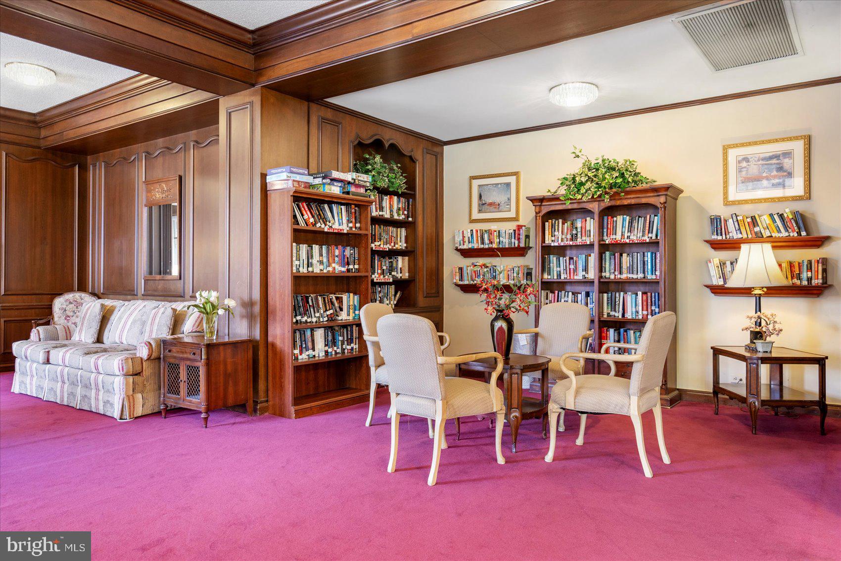 7111 Park Heights Avenue, Unit 305 Baltimore, MD 21215 - Photo 28 of 33 a dining room with furniture and chandelier