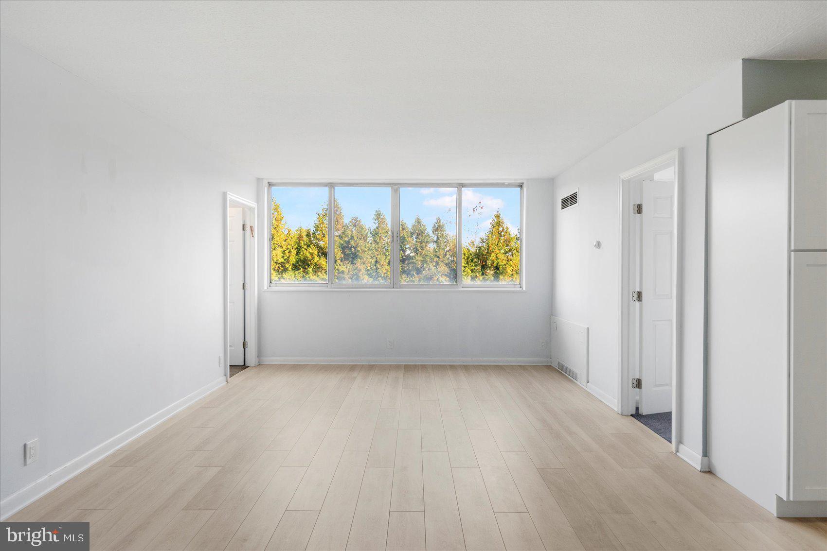 7111 Park Heights Avenue, Unit 305 Baltimore, MD 21215 - Photo 7 of 33 an empty room with window