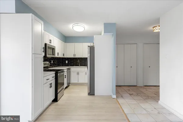 a kitchen with a stove and a microwave