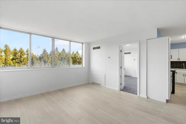 a view of a livingroom with a kitchen