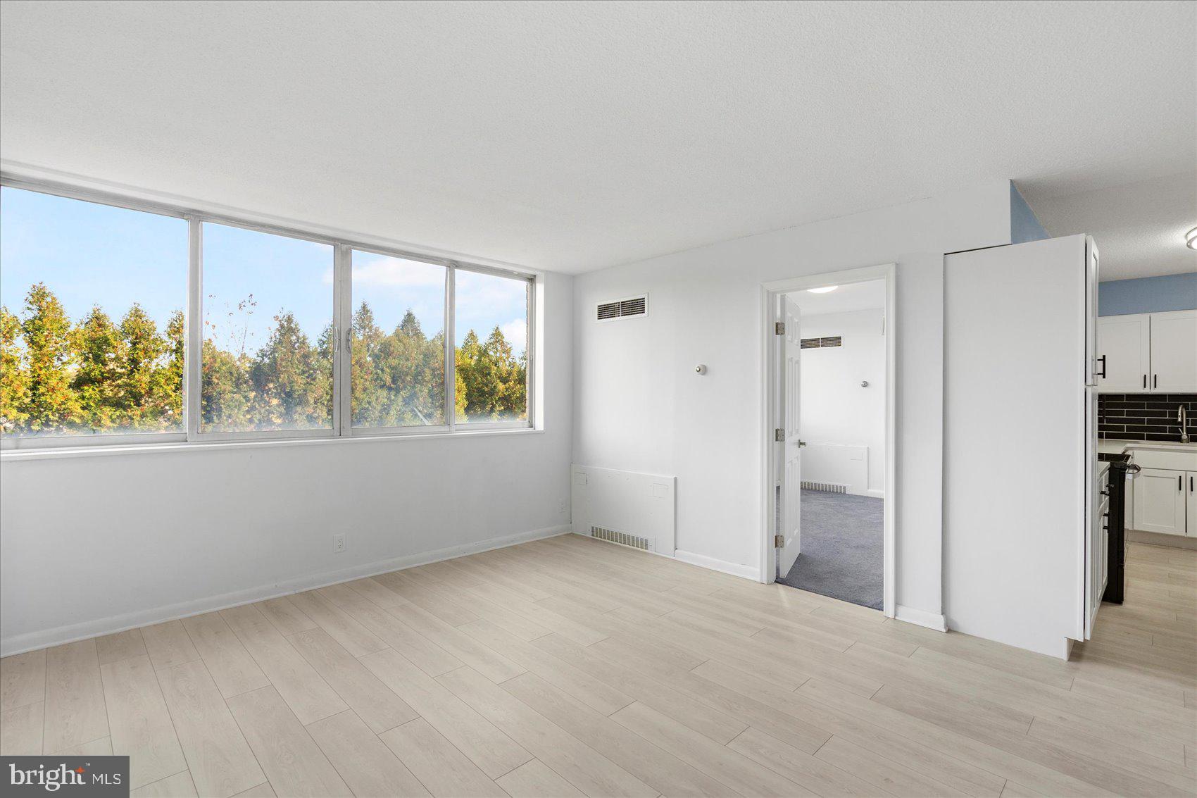 7111 Park Heights Avenue, Unit 305 Baltimore, MD 21215 - Photo 9 of 33 an empty room with a window