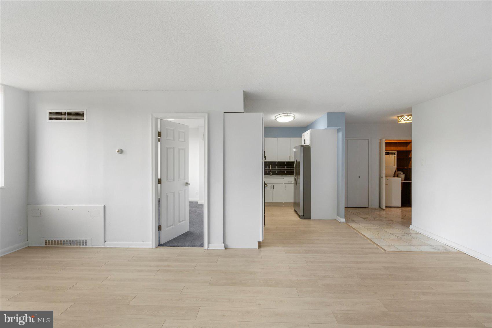 7111 Park Heights Avenue, Unit 305 Baltimore, MD 21215 - Photo 10 of 33 a view of a livingroom with a kitchen