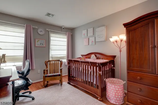 a bedroom with furniture and a window