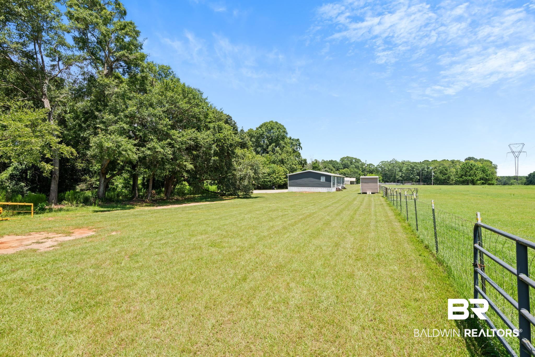 10703 South Ridge Drive Semmes, AL 36575 - Photo 10 of 37 View of yard featuring a view of countryside