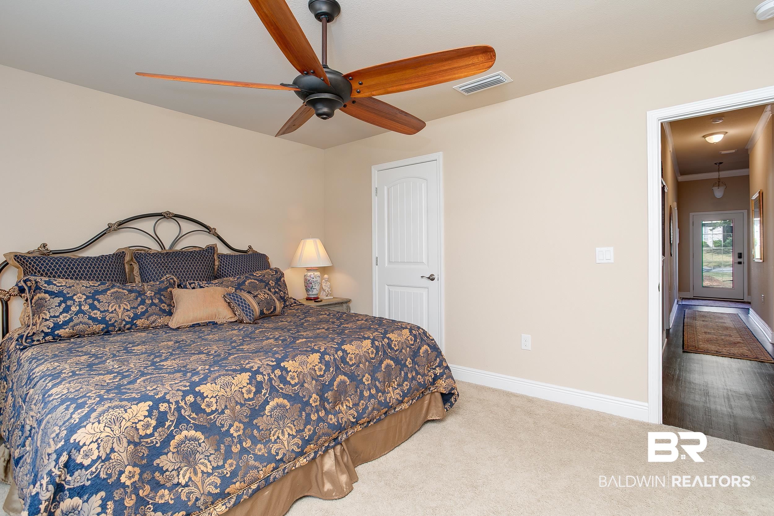 13154 Vincent Court Foley, AL 36535 - Photo 26 of 41 Bedroom featuring carpet, baseboards, ceiling fan, and visible vents