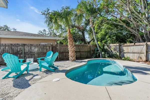 a view of a backyard with sitting area and furniture