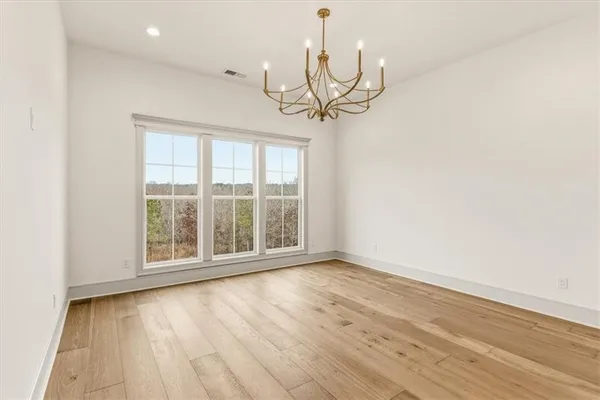 a white bath tub sitting next to a shower