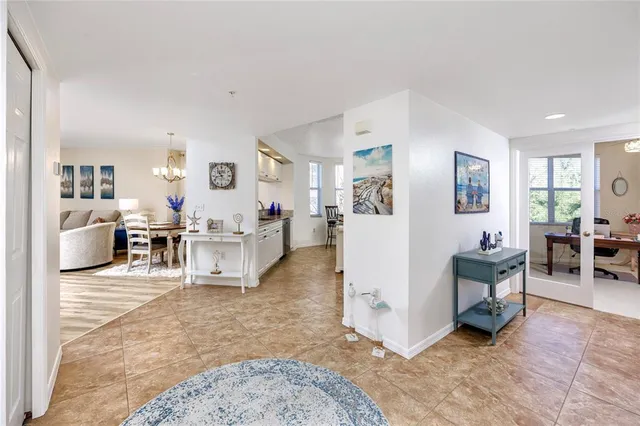 a kitchen with a refrigerator and a stove top oven