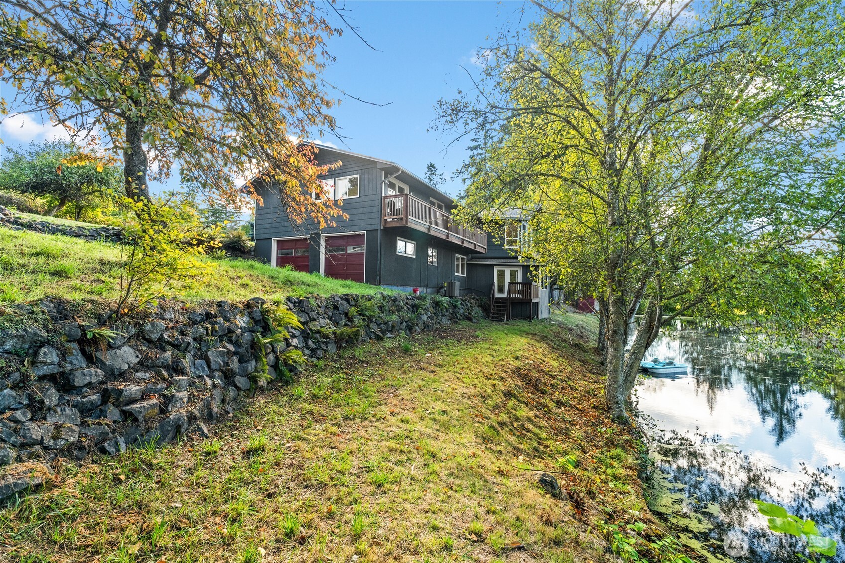 1305 336th Street South Roy, WA 98580 - Photo 1 of 40 a front view of a house with a yard