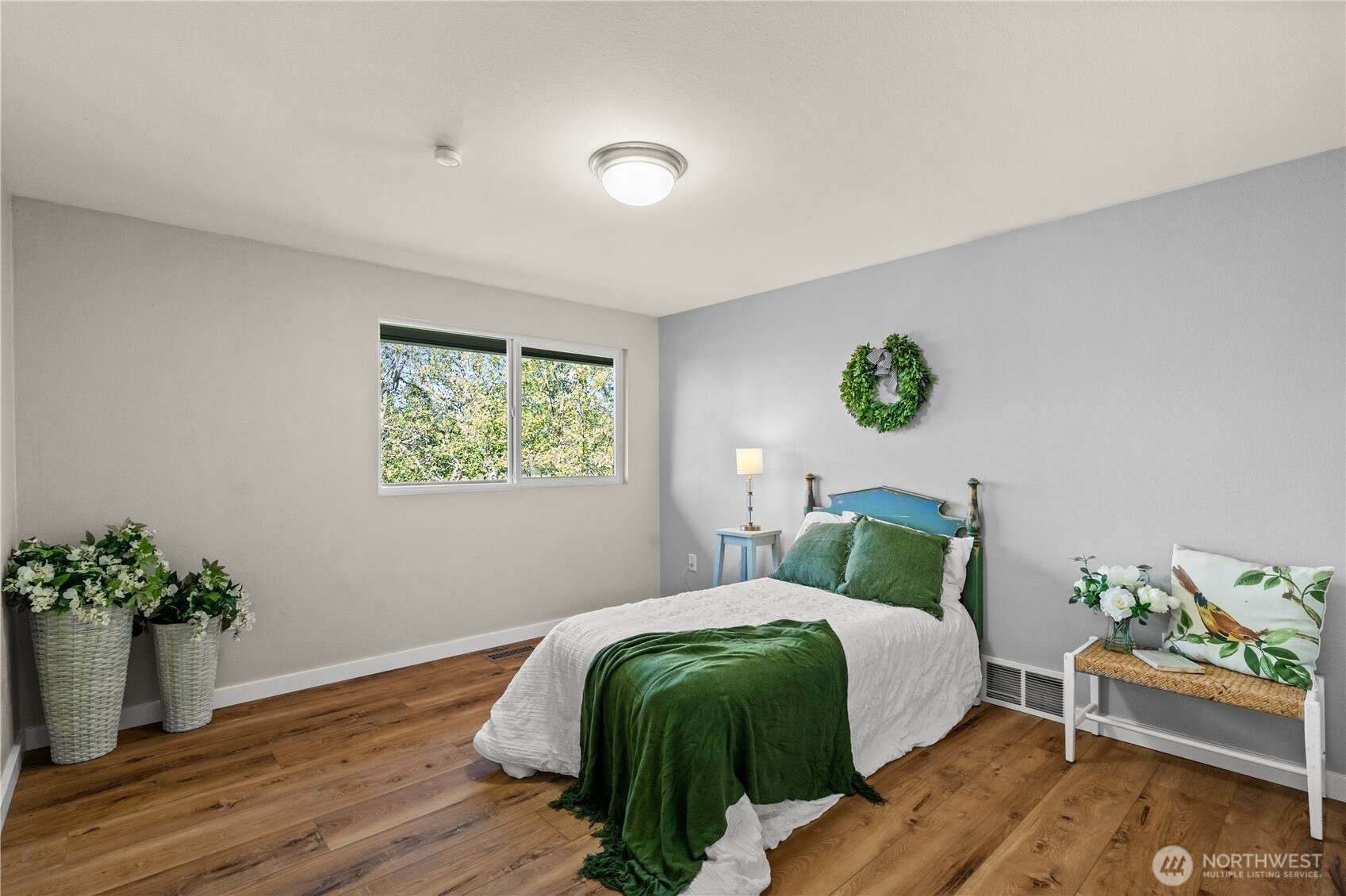 1305 336th Street South Roy, WA 98580 - Photo 15 of 40 a bedroom with a bed and a potted plant