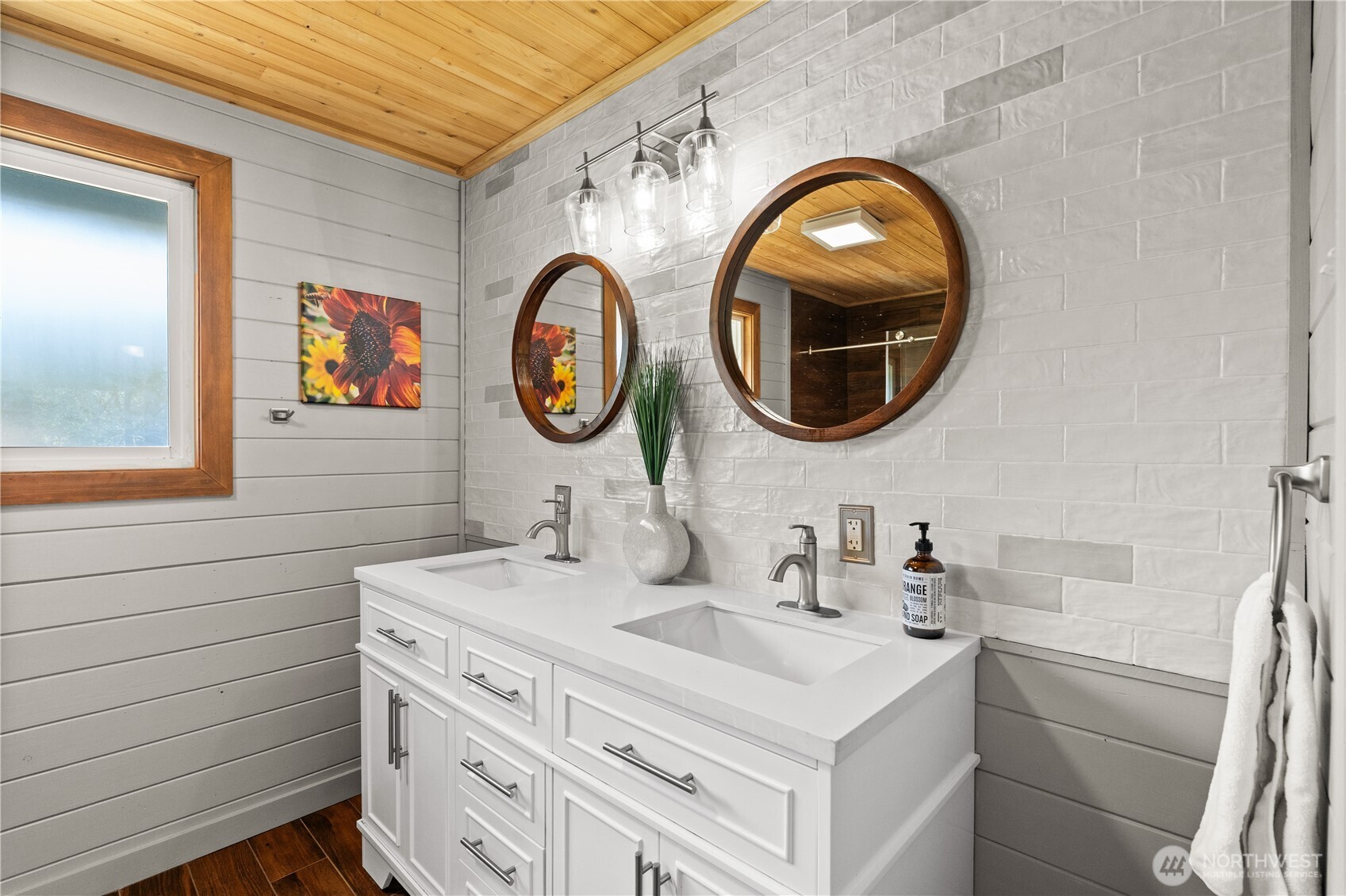 1305 336th Street South Roy, WA 98580 - Photo 16 of 40 a bathroom with a sink and a mirror