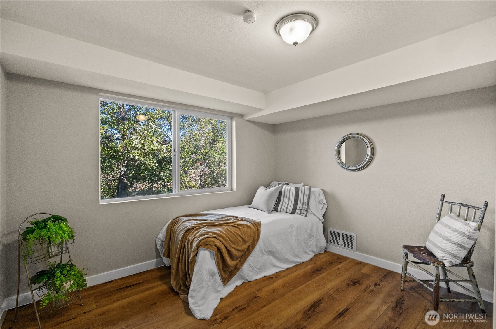 1305 336th Street South Roy, WA 98580 - Photo 25 of 40 a bedroom with a bed and a window