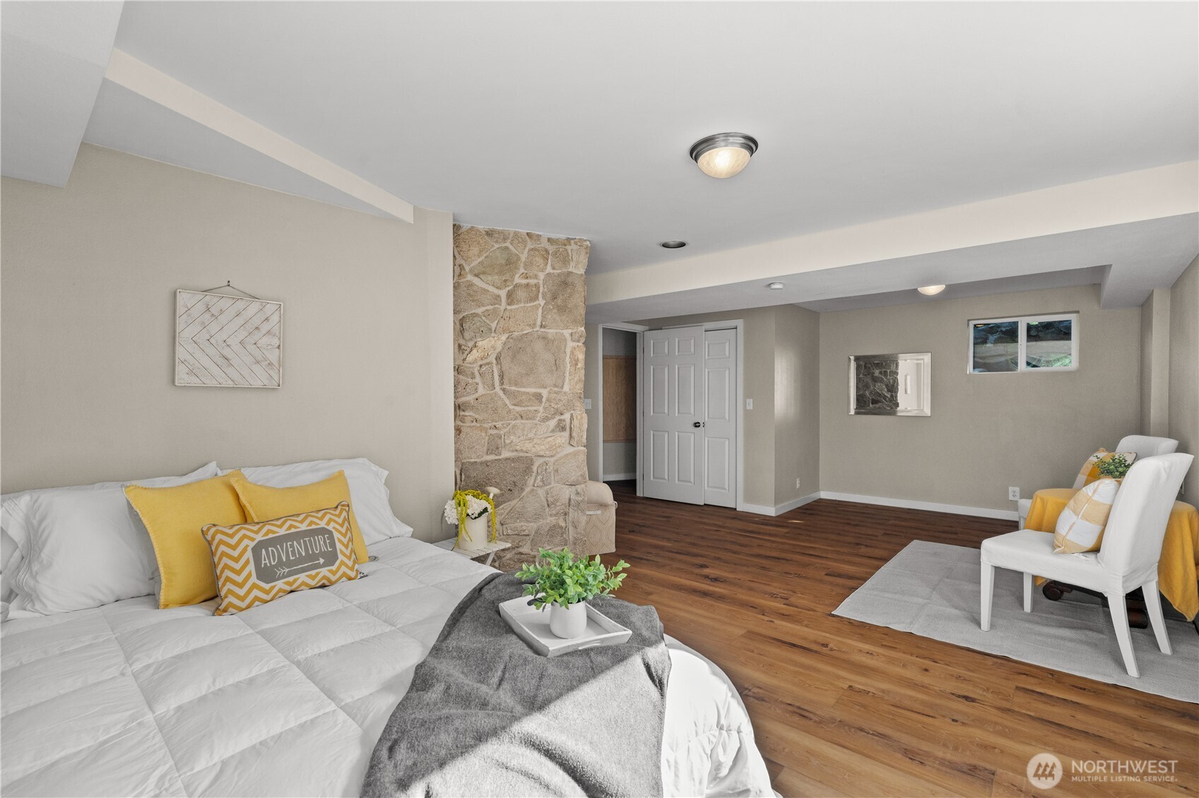 1305 336th Street South Roy, WA 98580 - Photo 29 of 40 a bedroom with a bed and a chair