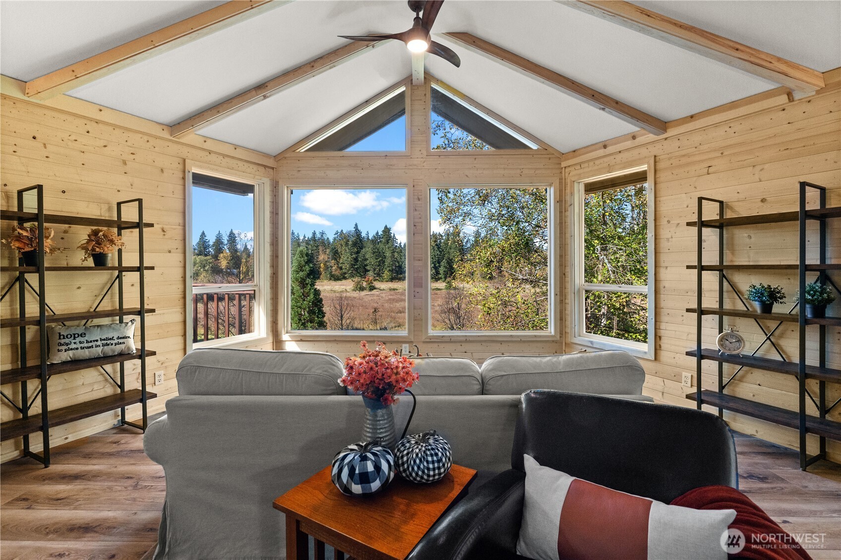 1305 336th Street South Roy, WA 98580 - Photo 3 of 40 a living room with furniture and a floor to ceiling window
