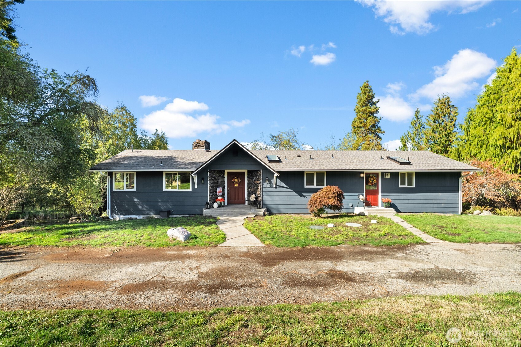 1305 336th Street South Roy, WA 98580 - Photo 32 of 40 a front view of a house with garden