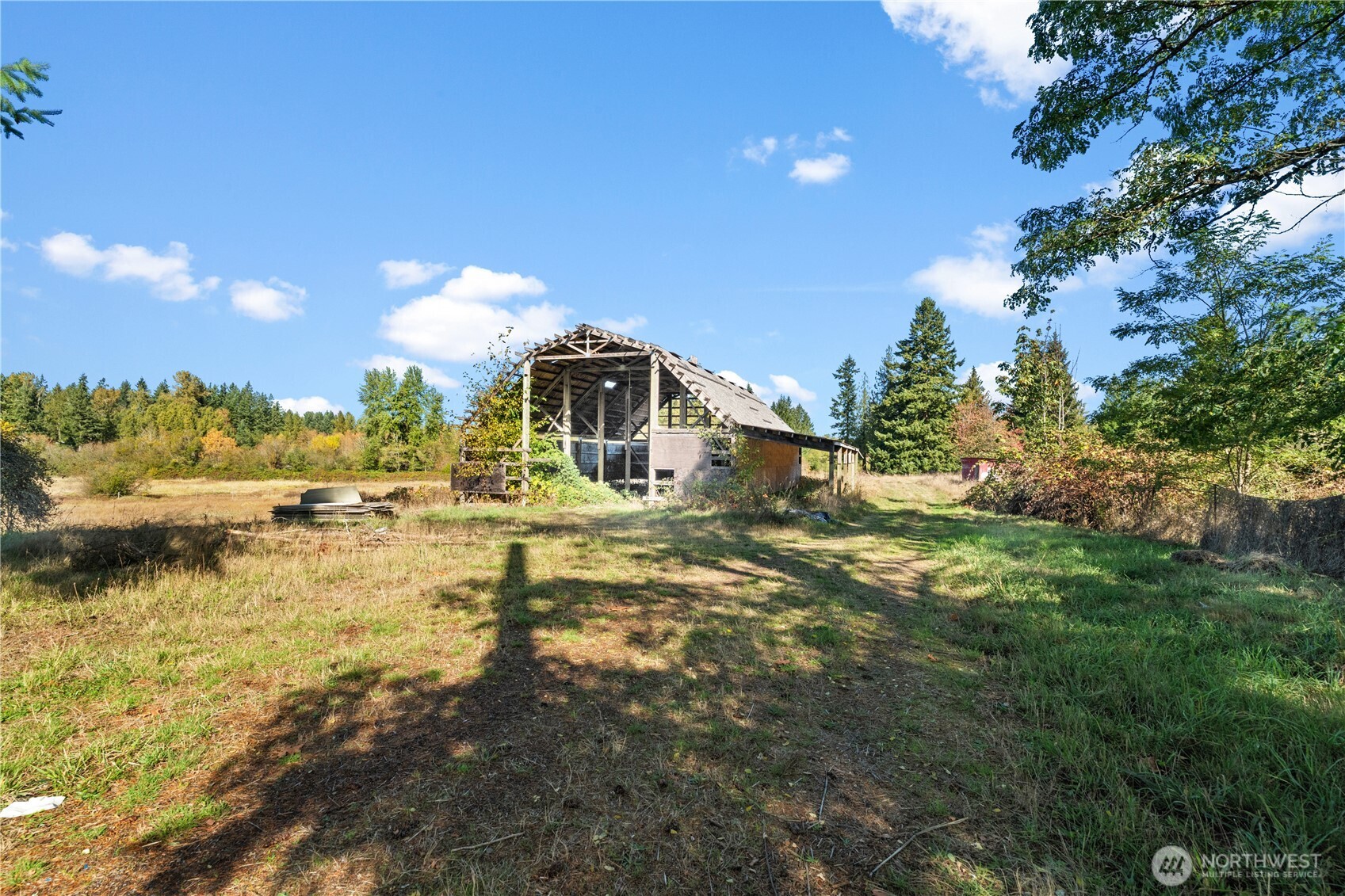 1305 336th Street South Roy, WA 98580 - Photo 34 of 40 a view of a lake with a house