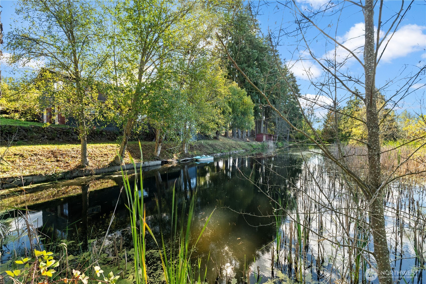 1305 336th Street South Roy, WA 98580 - Photo 35 of 40 a view of river covered by trees and buildings