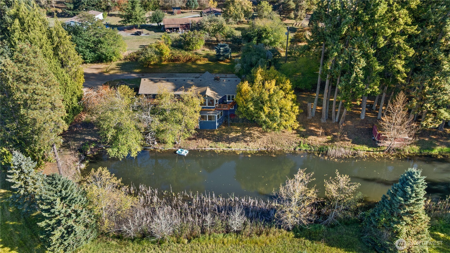 1305 336th Street South Roy, WA 98580 - Photo 39 of 40 an aerial view of water body with trees all around