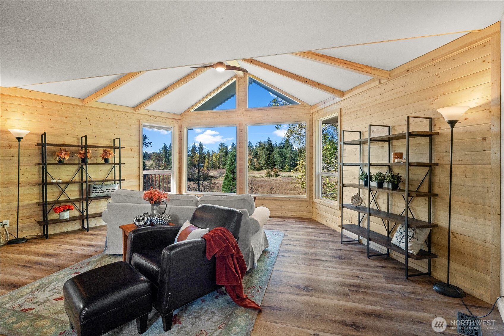 1305 336th Street South Roy, WA 98580 - Photo 4 of 40 a living room with furniture a rug and a flat screen tv
