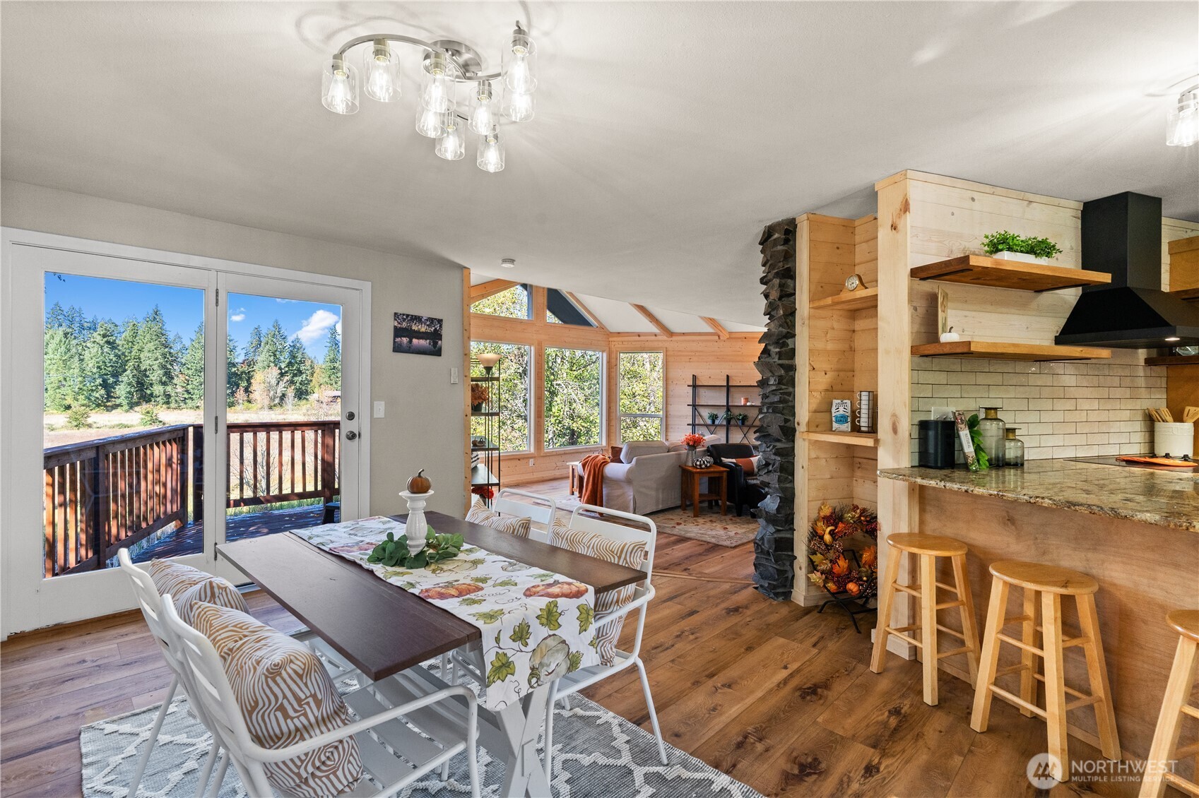 1305 336th Street South Roy, WA 98580 - Photo 6 of 40 a living room with furniture a fireplace and a flat screen tv