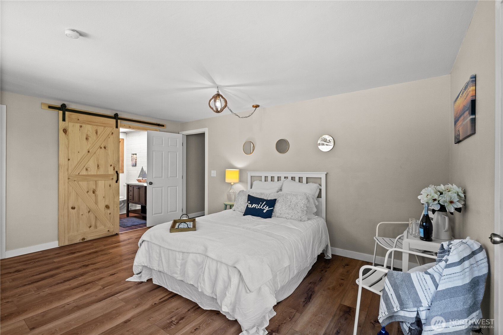 1305 336th Street South Roy, WA 98580 - Photo 10 of 40 a bedroom with a bed and wooden floor