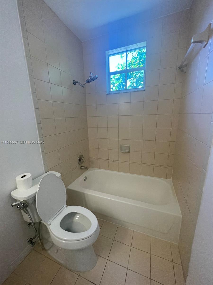 3421 Southwest 25th Street, Unit 1 Miami, FL 33133 - Photo 22 of 41 a bathroom with a toilet bathtub and sink