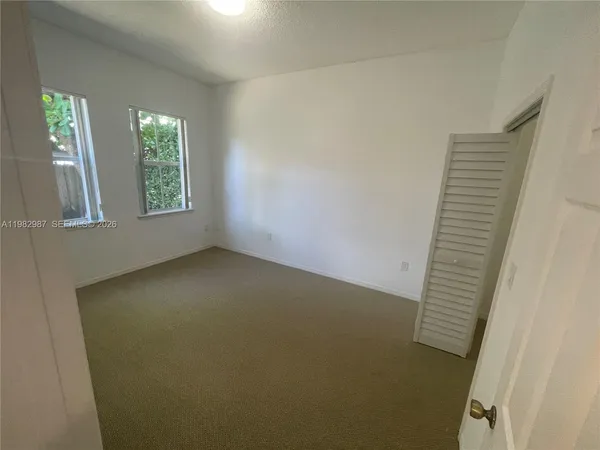 an empty room with windows