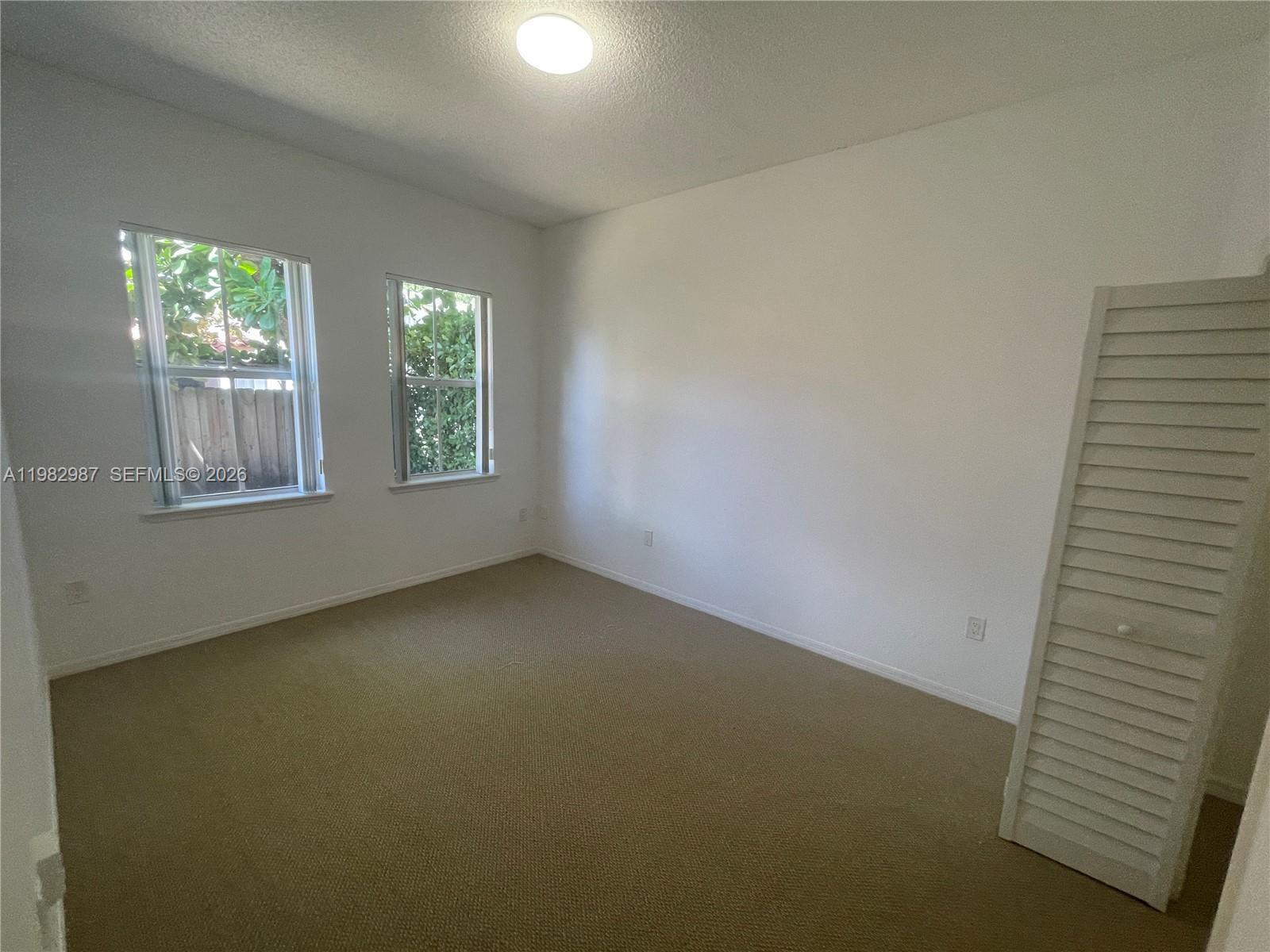 3421 Southwest 25th Street, Unit 1 Miami, FL 33133 - Photo 26 of 41 an empty room with windows